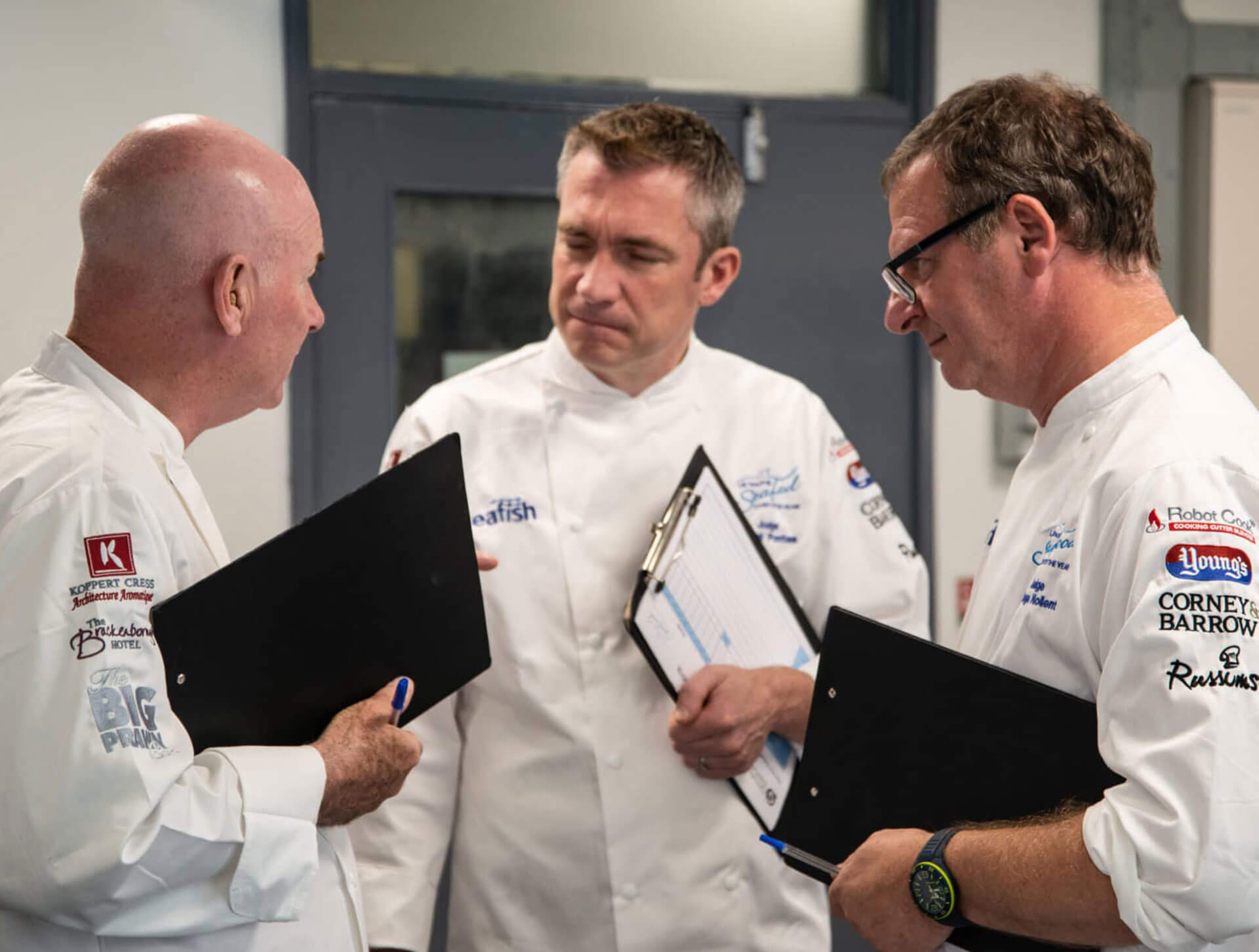 Seafood judges discussing the competition